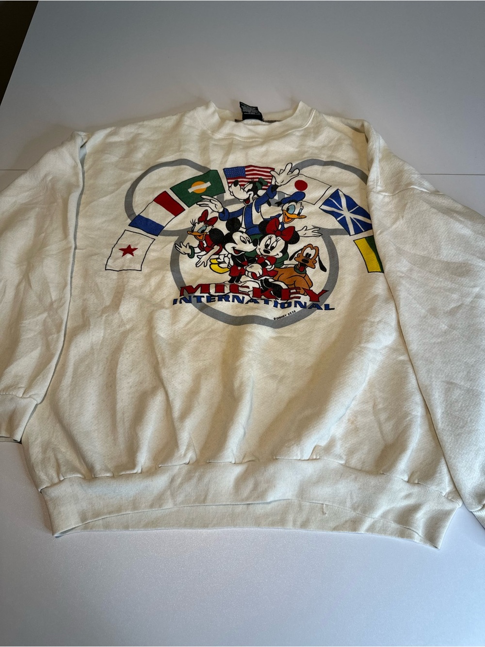 Disney Cream Crewneck Sweatshirt with Mickey & Friends International Flags